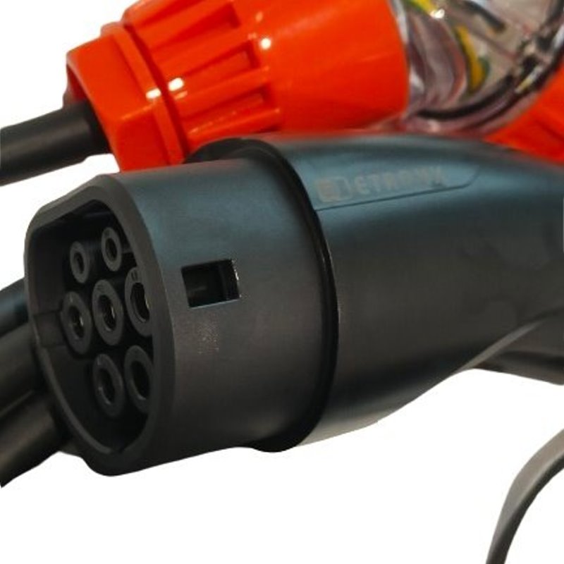 Close-up of an electric vehicle charging cable connector with orange and black colors.